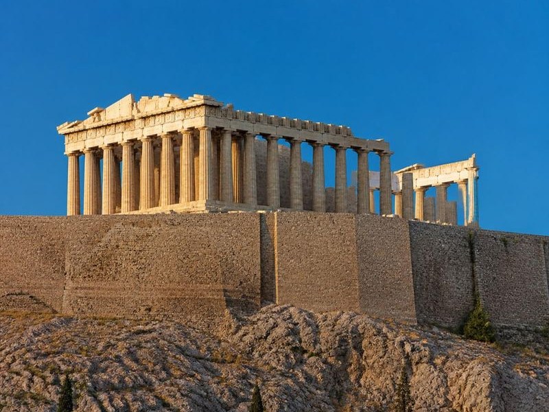 The Parthenon on the Acropolis of Athens in warm daylight, seen from the marble walkway